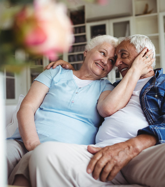 elderly couple smiling