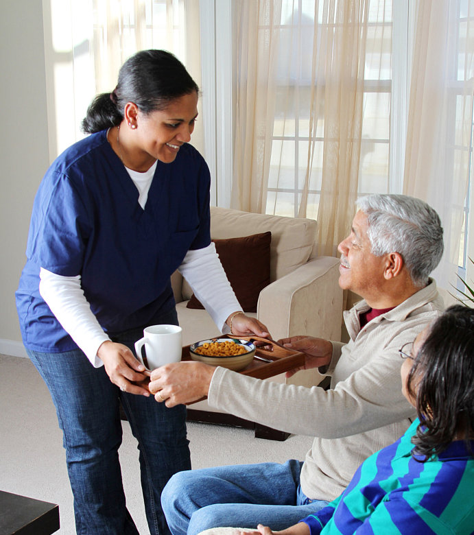 caregiver assisting seniors