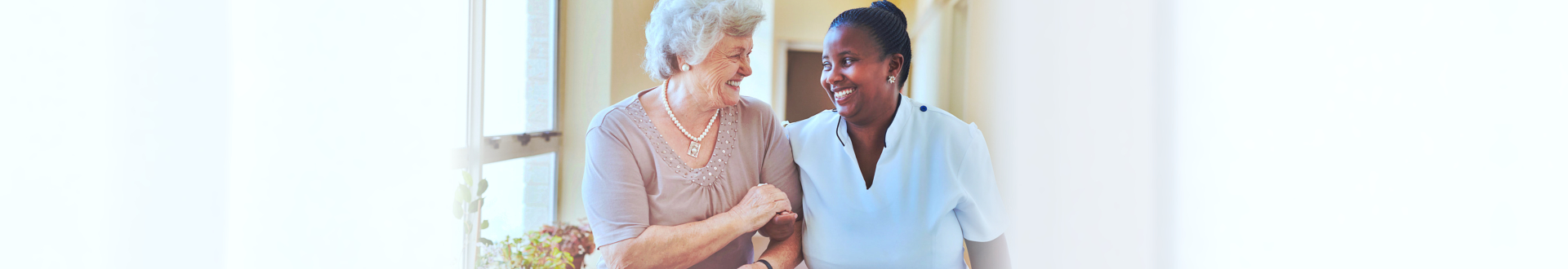 nurse and caregiver walking together